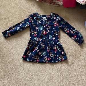 Never wore. Shirt flares out at the end. Arm ruffled. Navy blue/pink. Girl.